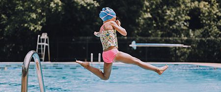 Girl diving into pool.