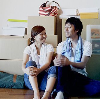 Couple sitting on floor.
