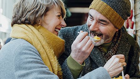 Elderly couple eating.