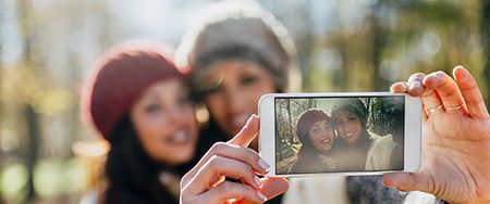 Women taking selfie.