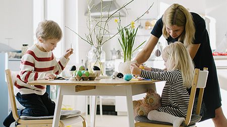 Family painting eggs