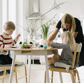 Family painting eggs.