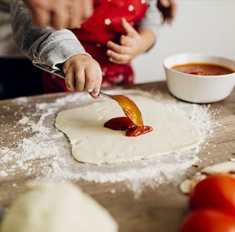 Preparing pizza together.